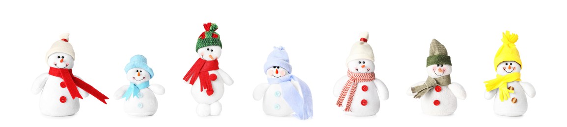 Image of Set with cute small snowman toys on white background. Banner design