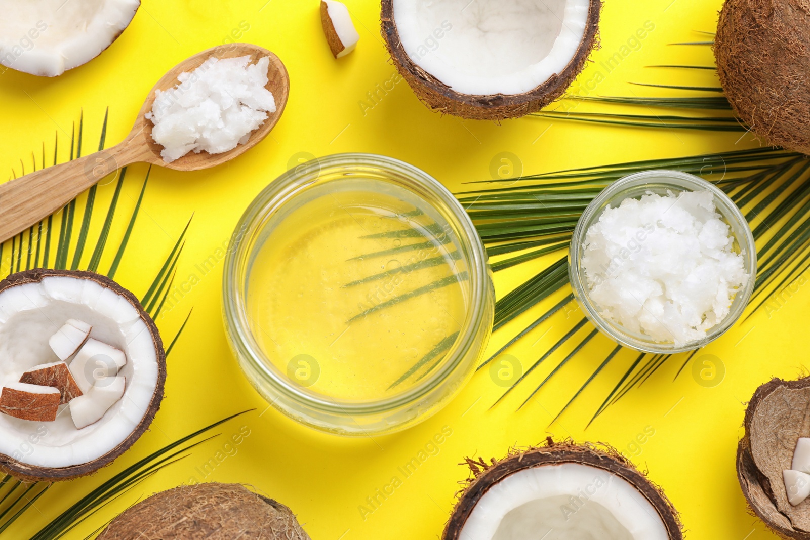 Photo of Flat lay composition with coconut oil on yellow background