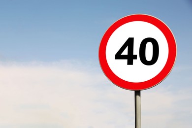 Road sign Maximum speed limit against blue sky