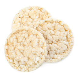 Photo of Puffed rice cakes isolated on white, top view. Healthy snack