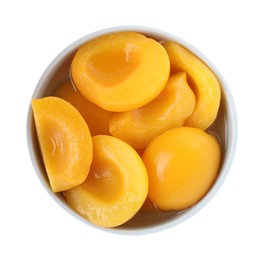 Photo of Halves of canned peaches in bowl isolated on white, top view