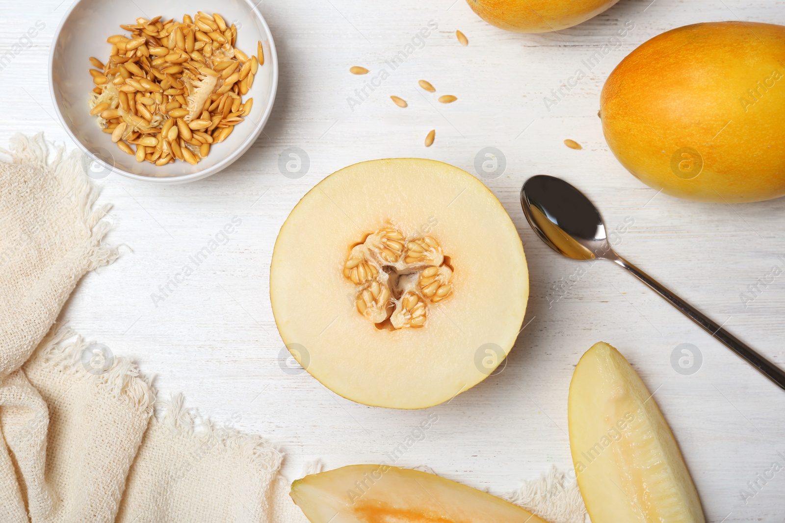 Photo of Flat lay composition with delicious cut melon on table