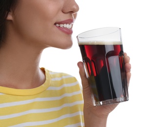 Photo of Young woman with cold kvass on white background, closeup. Traditional Russian summer drink