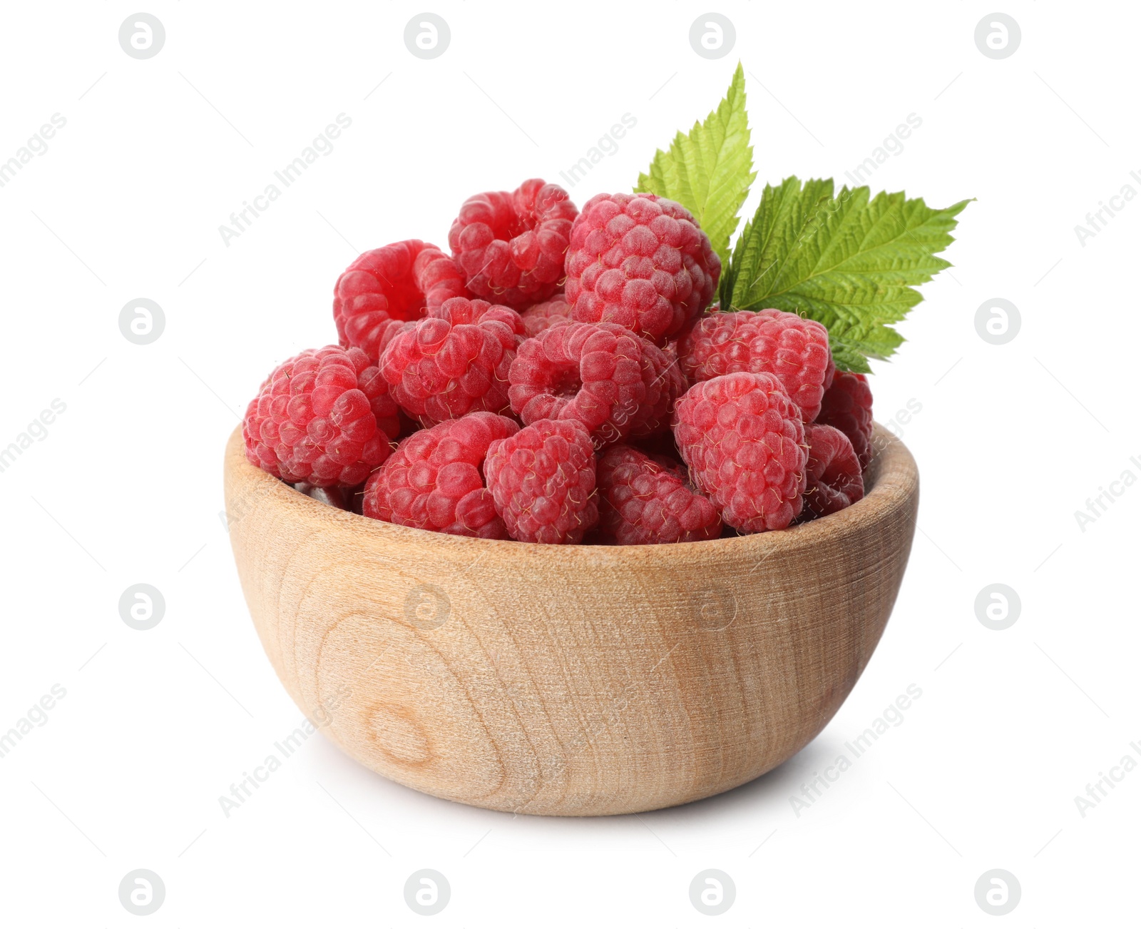 Photo of Bowl of delicious fresh ripe raspberries with leaves on white background