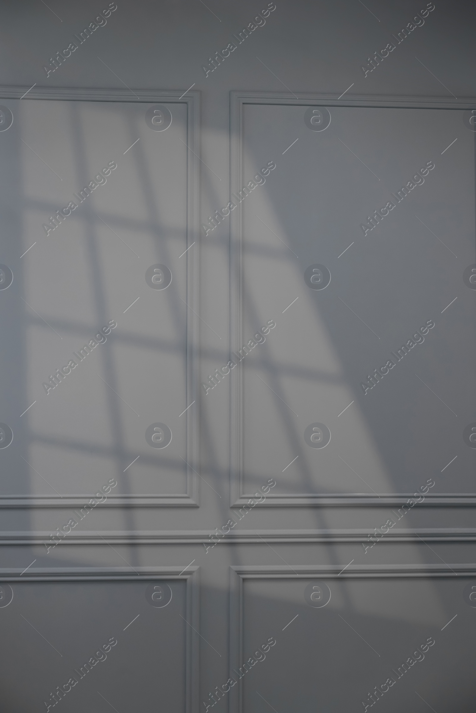 Photo of Shadow from window on grey wall indoors
