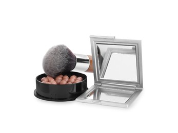 Photo of Stylish cosmetic pocket mirror, blusher and brush on white background