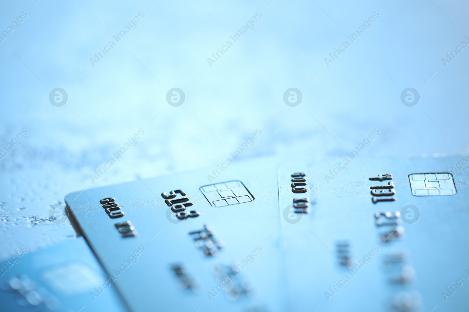 Photo of Plastic credit cards on table, closeup view. Space for text