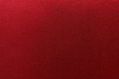 Texture of beautiful red silk fabric as background, closeup