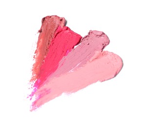 Smears of different beautiful lipsticks on white background