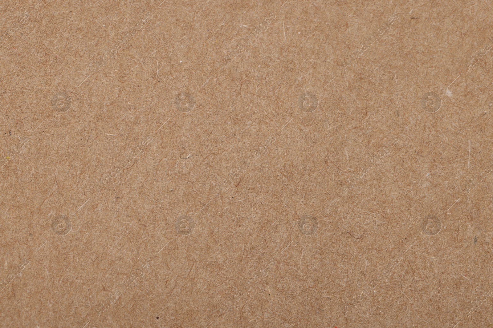 Photo of Texture of brown paper sheet as background, top view