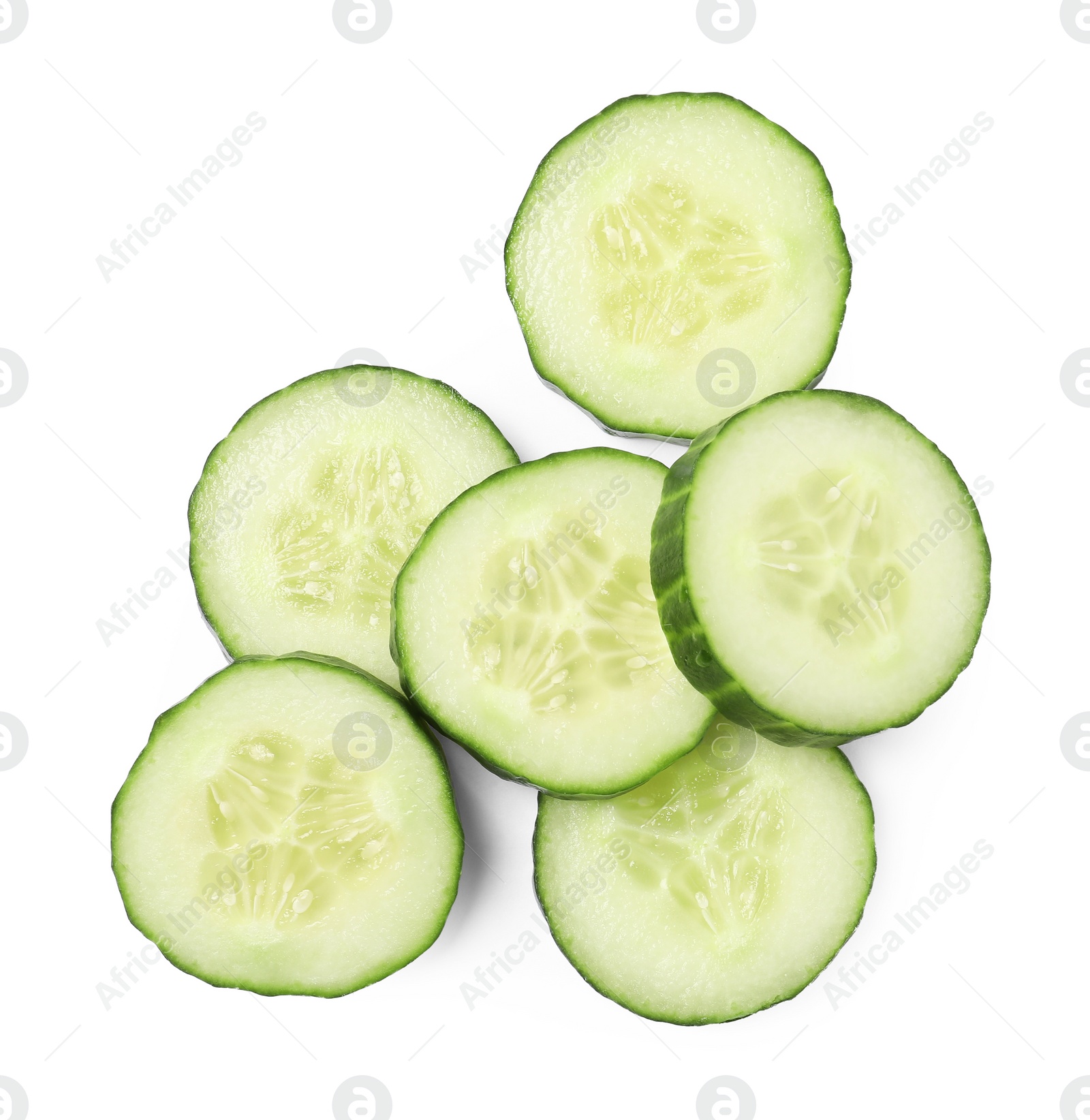 Photo of Pile of fresh cut cucumber isolated on white, top view