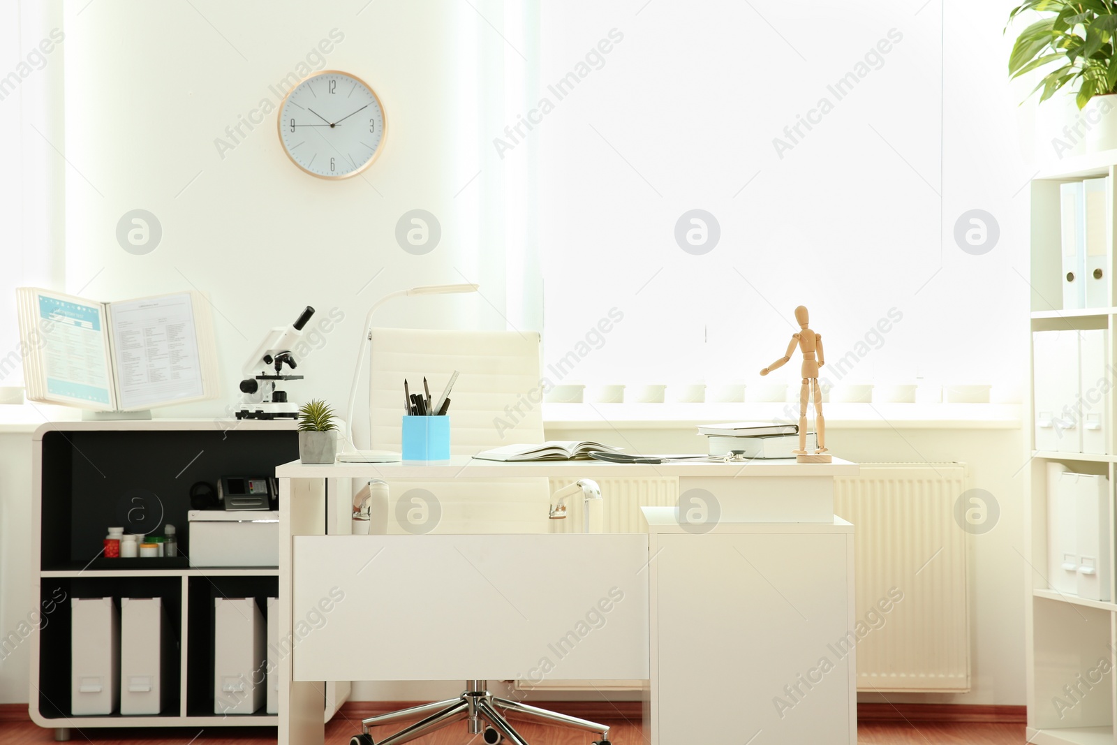 Photo of Interior of modern medical office. Doctor's workplace