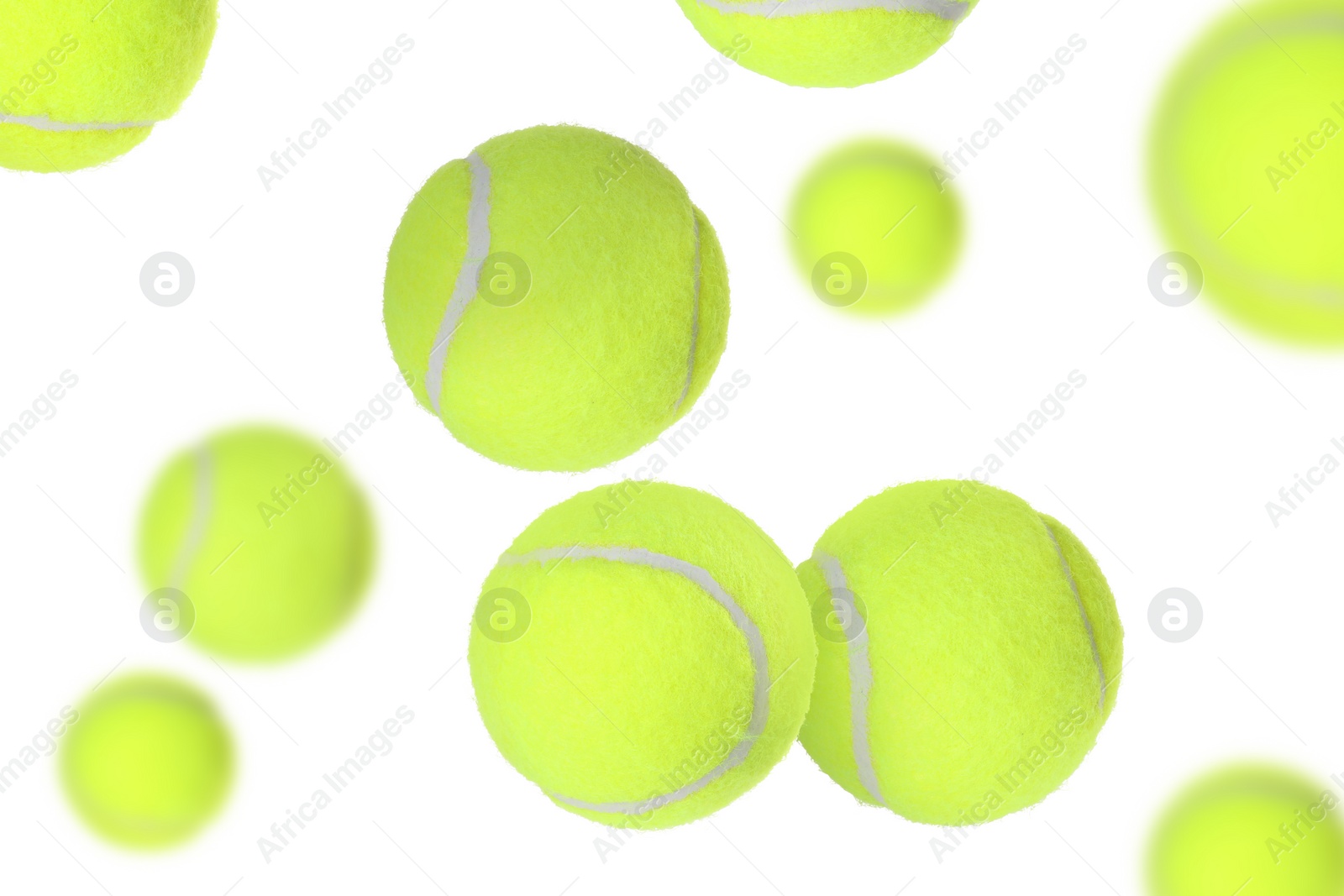 Image of Many tennis balls flying on white background