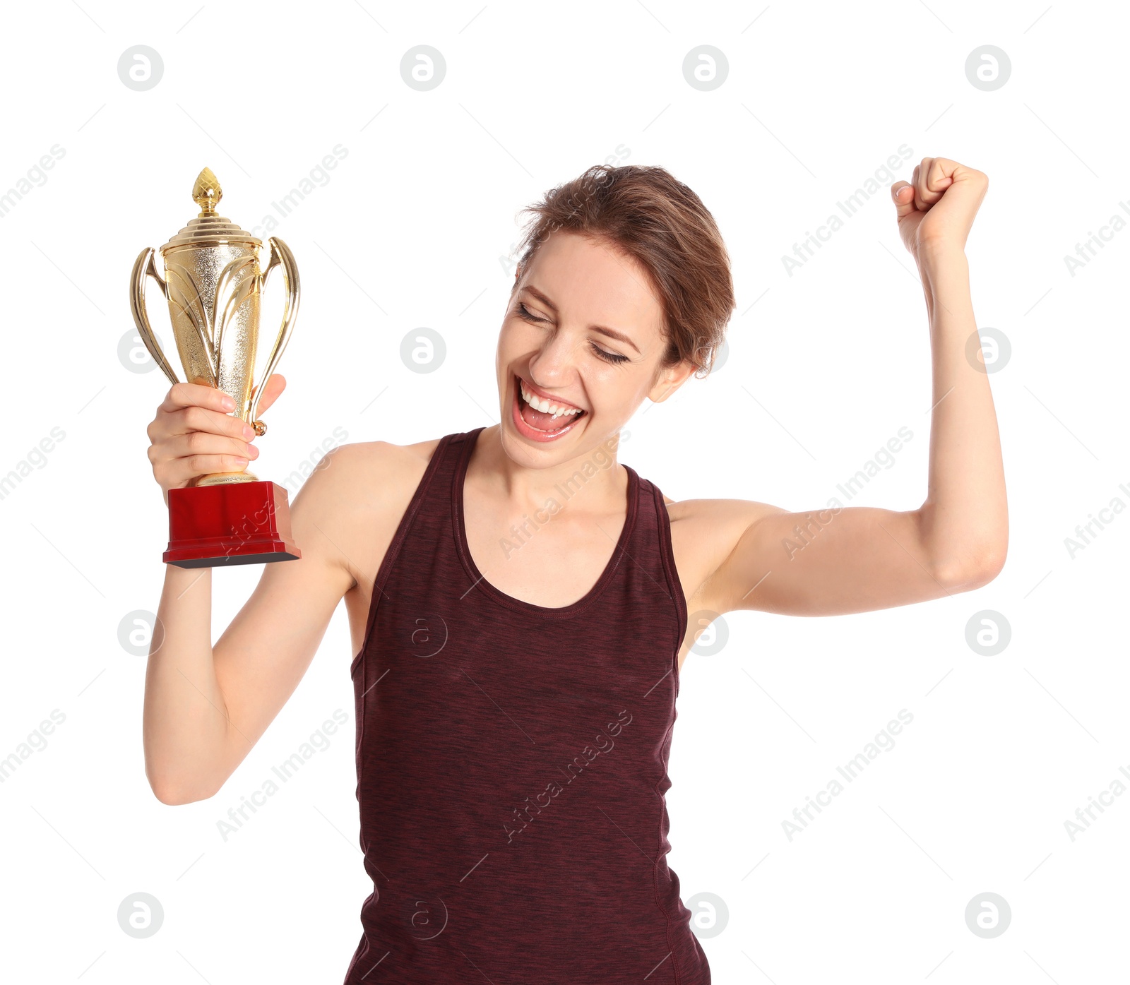 Photo of Portrait of happy young sportswoman with gold trophy cup on white background