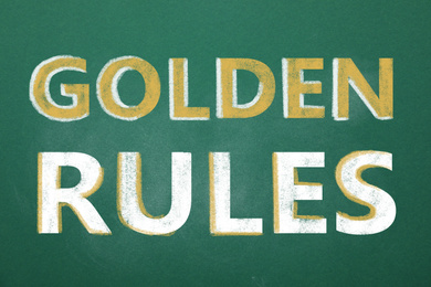 Image of Green chalkboard with phrase GOLDEN RULES, closeup