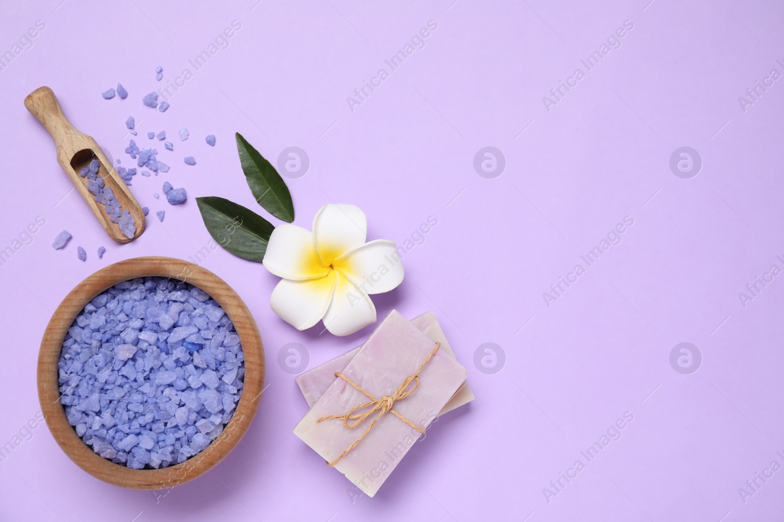 Photo of Beautiful spa composition with sea salt on violet background, flat lay. Space for text