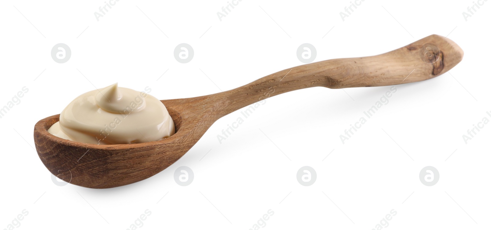 Photo of Natural yogurt in wooden spoon isolated on white