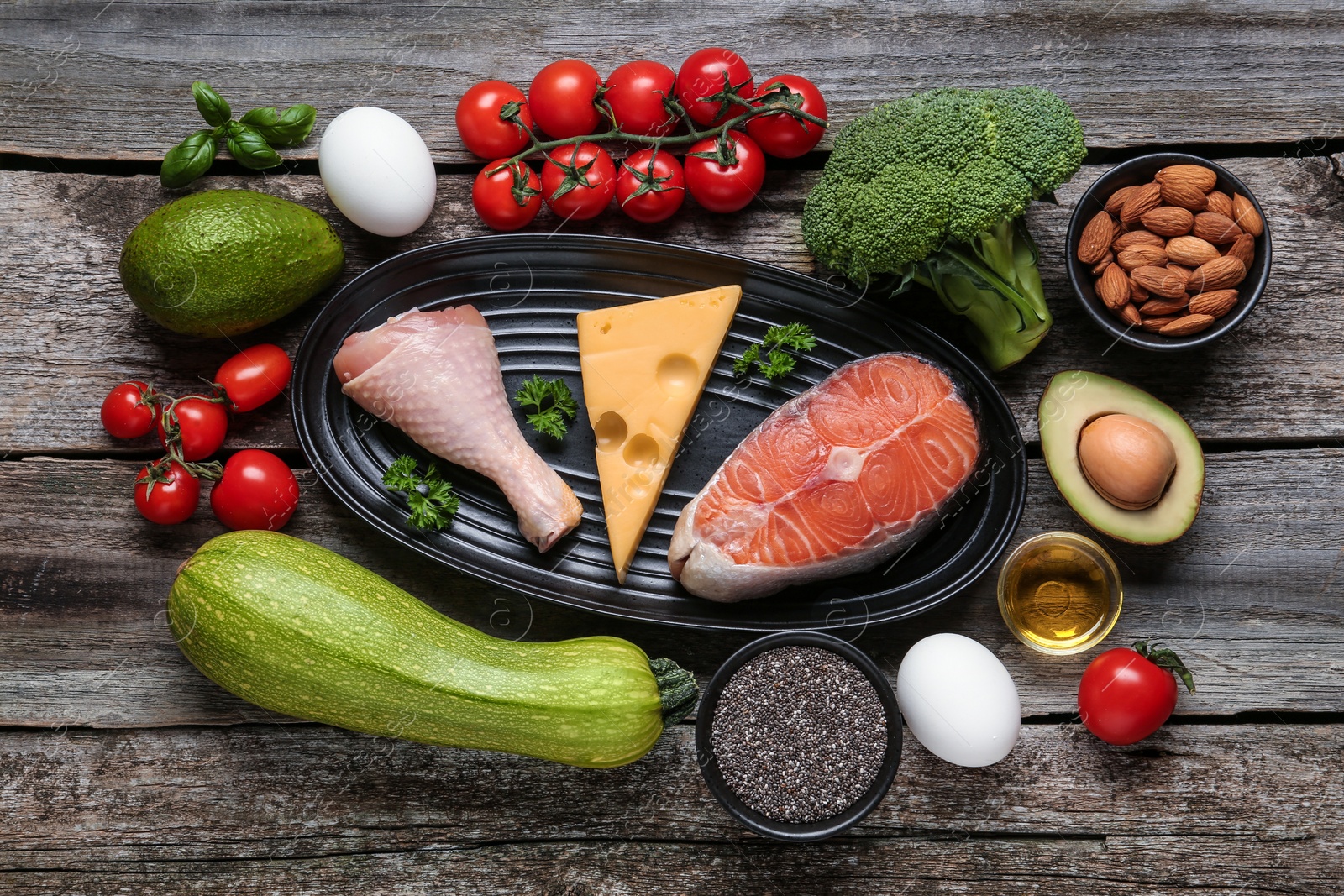 Photo of Flat lay composition with keto diet products on wooden table