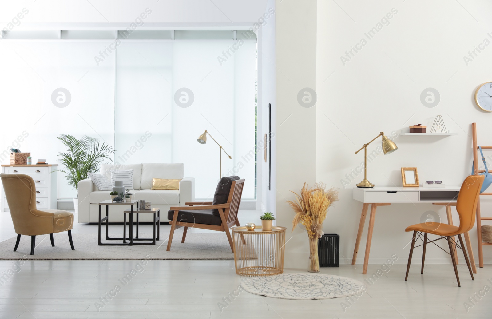 Photo of Living room and workplace in spacious apartment. Interior design