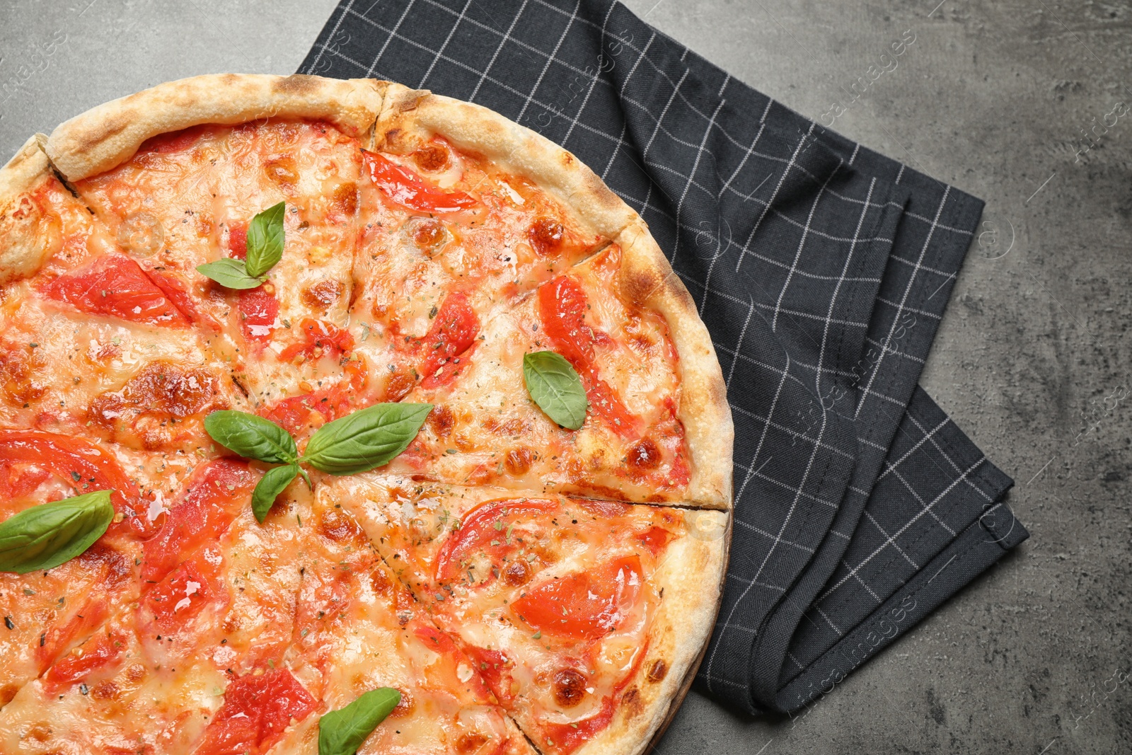 Photo of Delicious pizza Margherita on grey table, top view