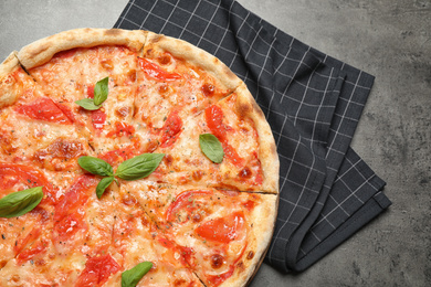 Photo of Delicious pizza Margherita on grey table, top view