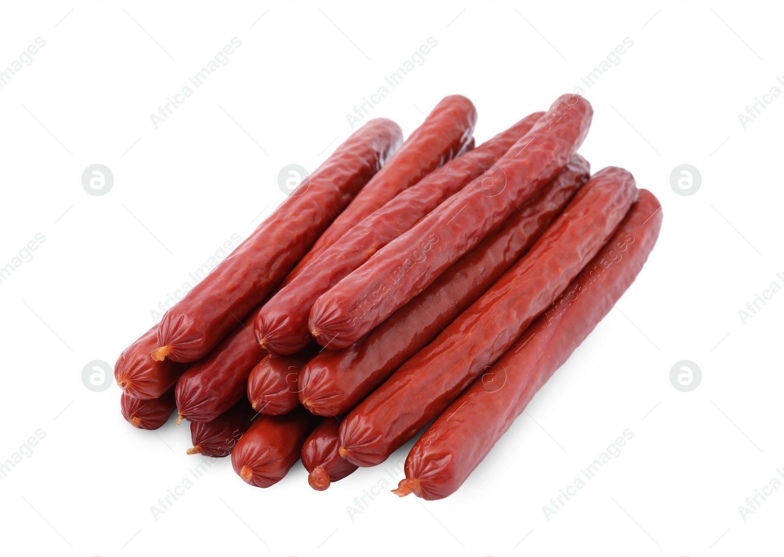 Photo of Many delicious smoked sausages isolated on white