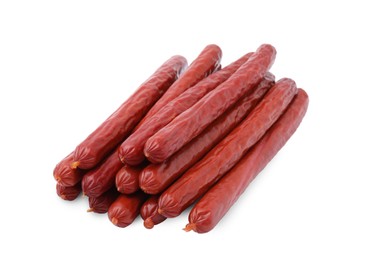 Photo of Many delicious smoked sausages isolated on white