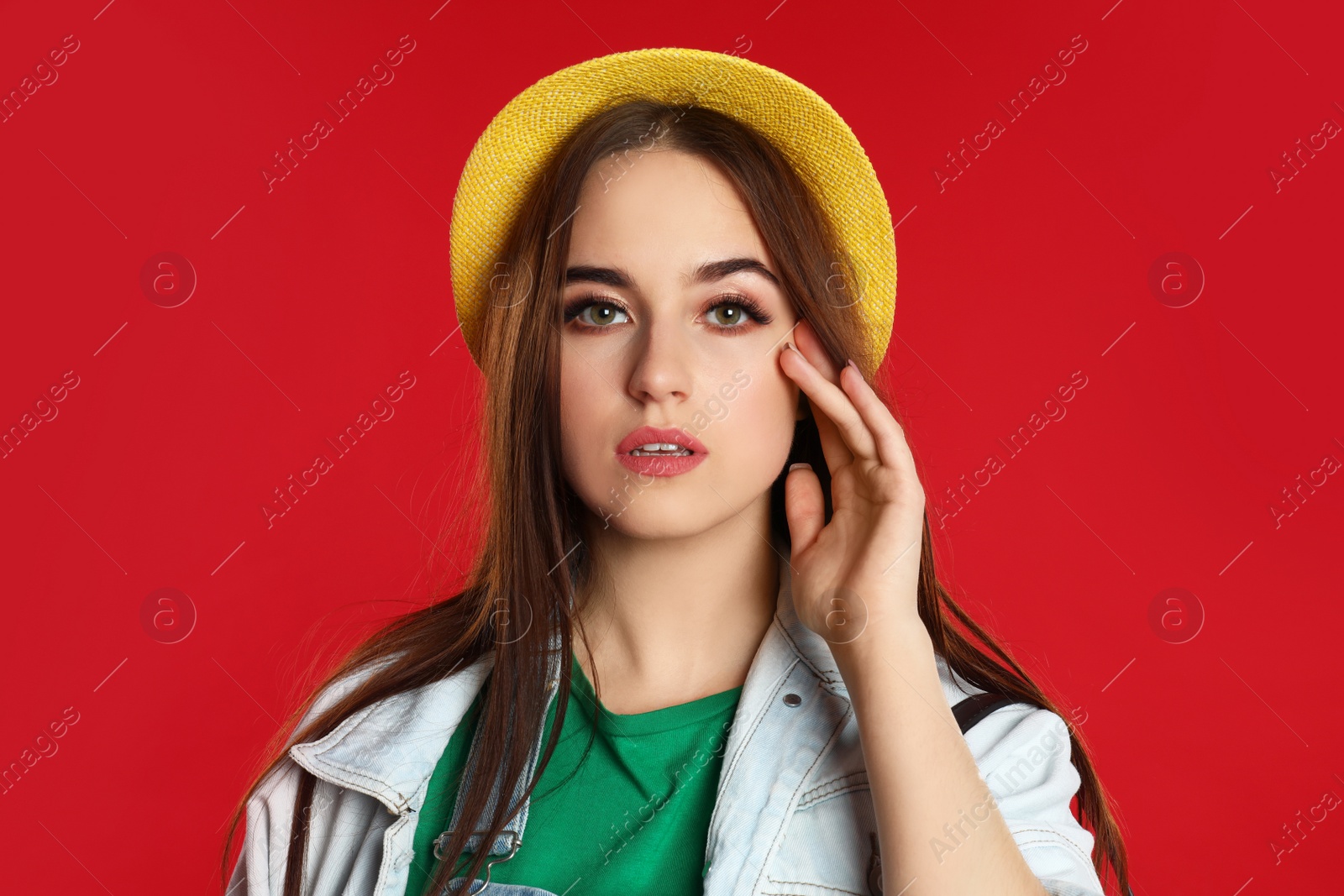Photo of Portrait of beautiful woman on red background