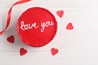 Photo of Bento cake with text Love You, ribbon, paper hearts and space for text on white wooden table, flat lay. St. Valentine's day surprise