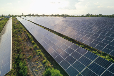 Photo of Solar panels installed outdoors. Alternative energy source