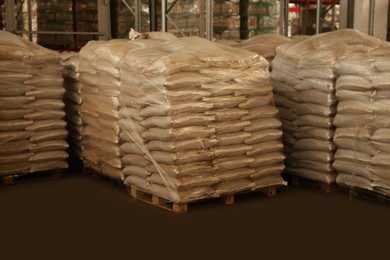 Warehouse with stacks of bags on wooden pallets. Wholesaling