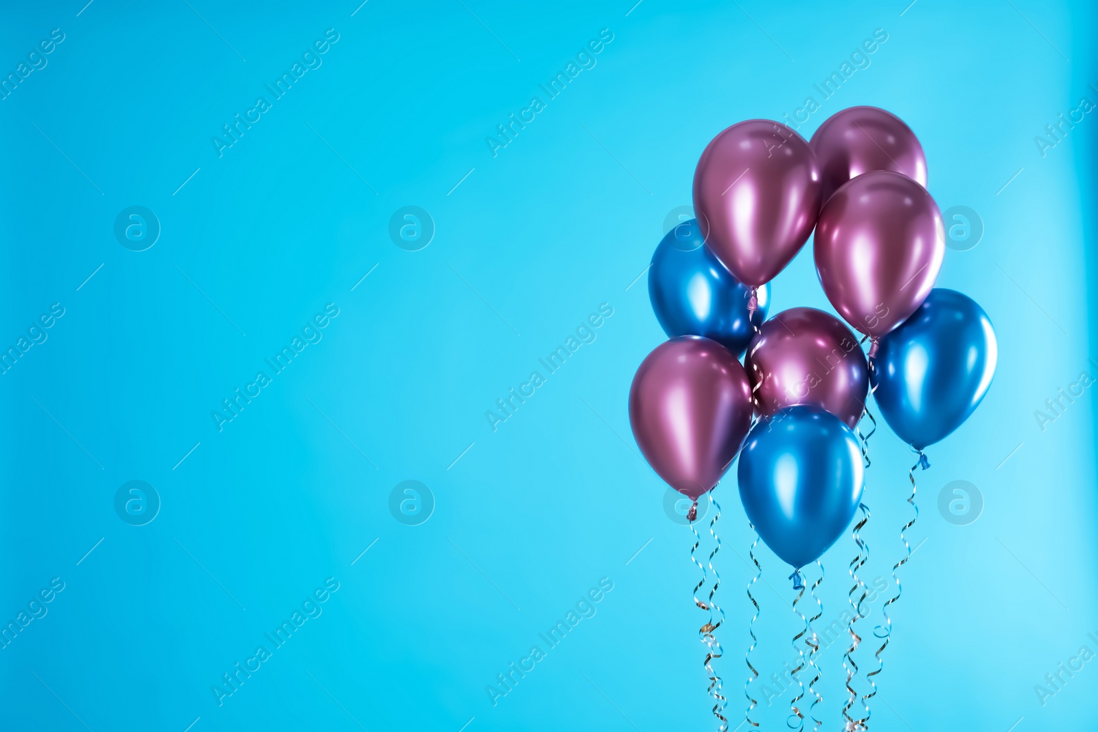 Photo of Bright balloons on color background. Space for text