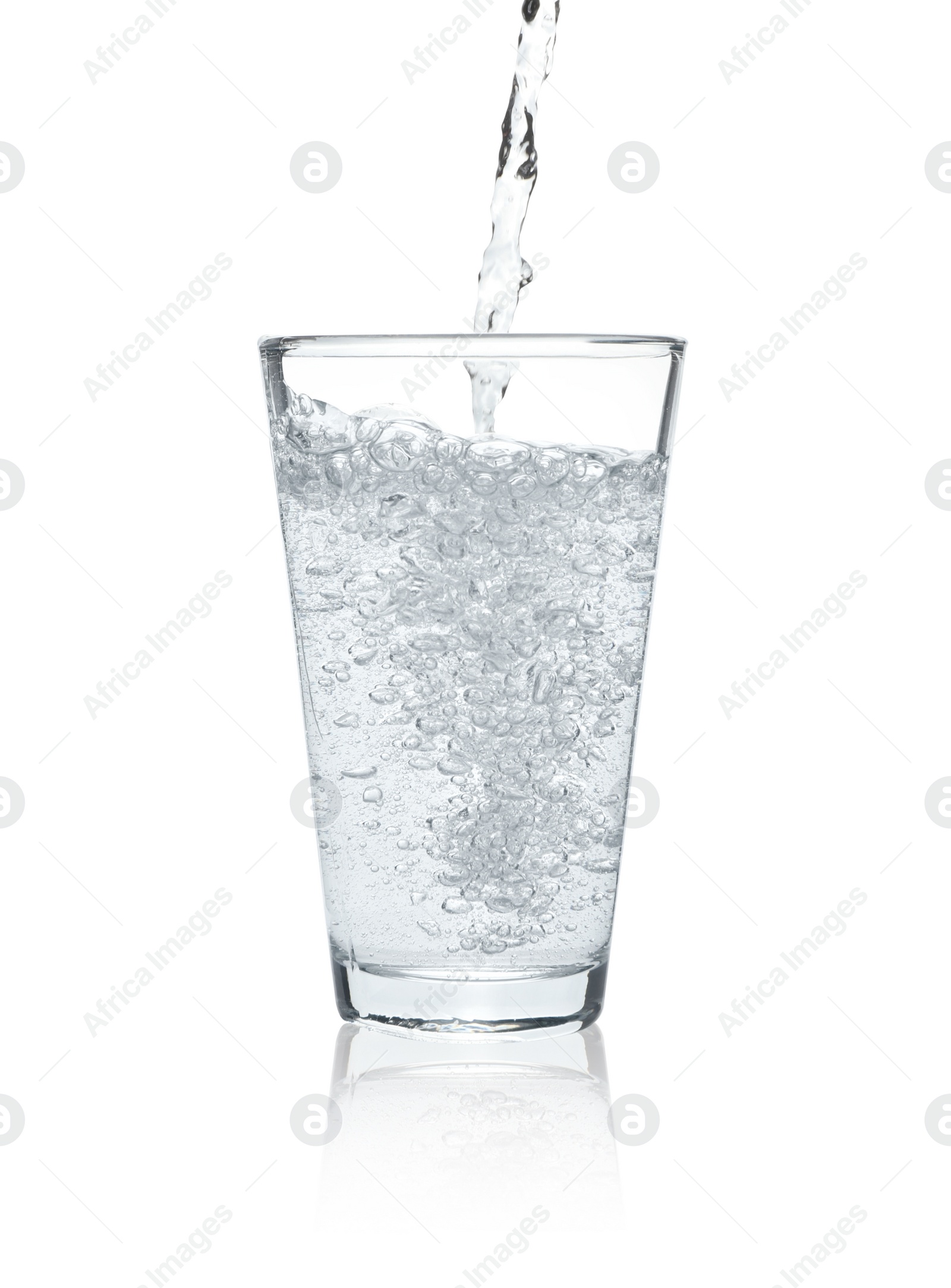 Photo of Pouring soda water into glass on white background