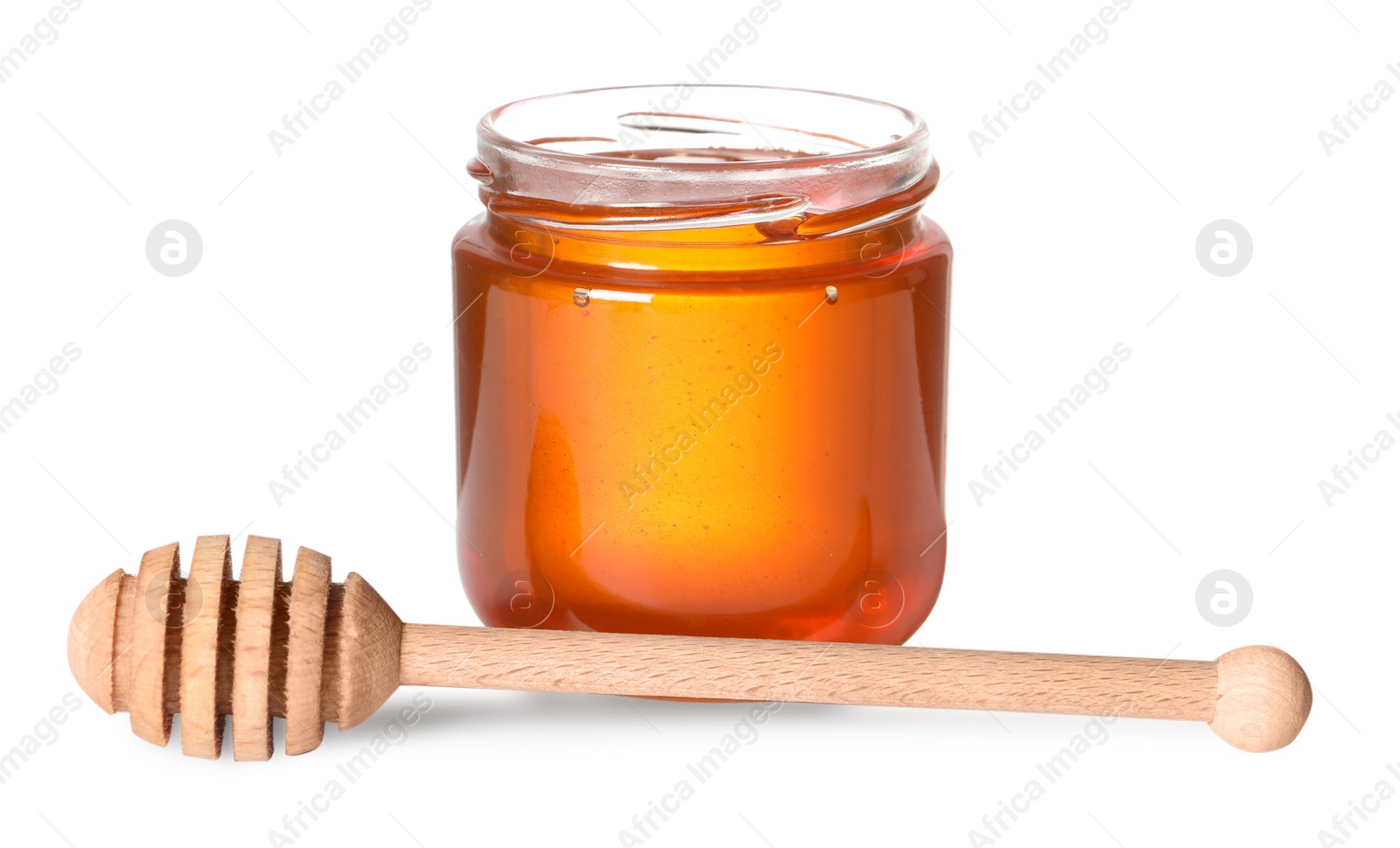 Photo of Tasty natural honey in glass jar and dipper isolated on white