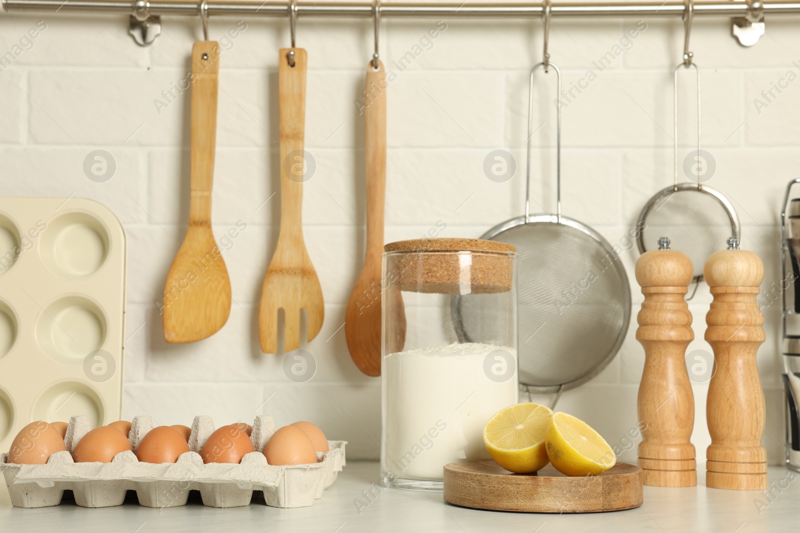 Photo of Countertop with cooking utensils and products in kitchen