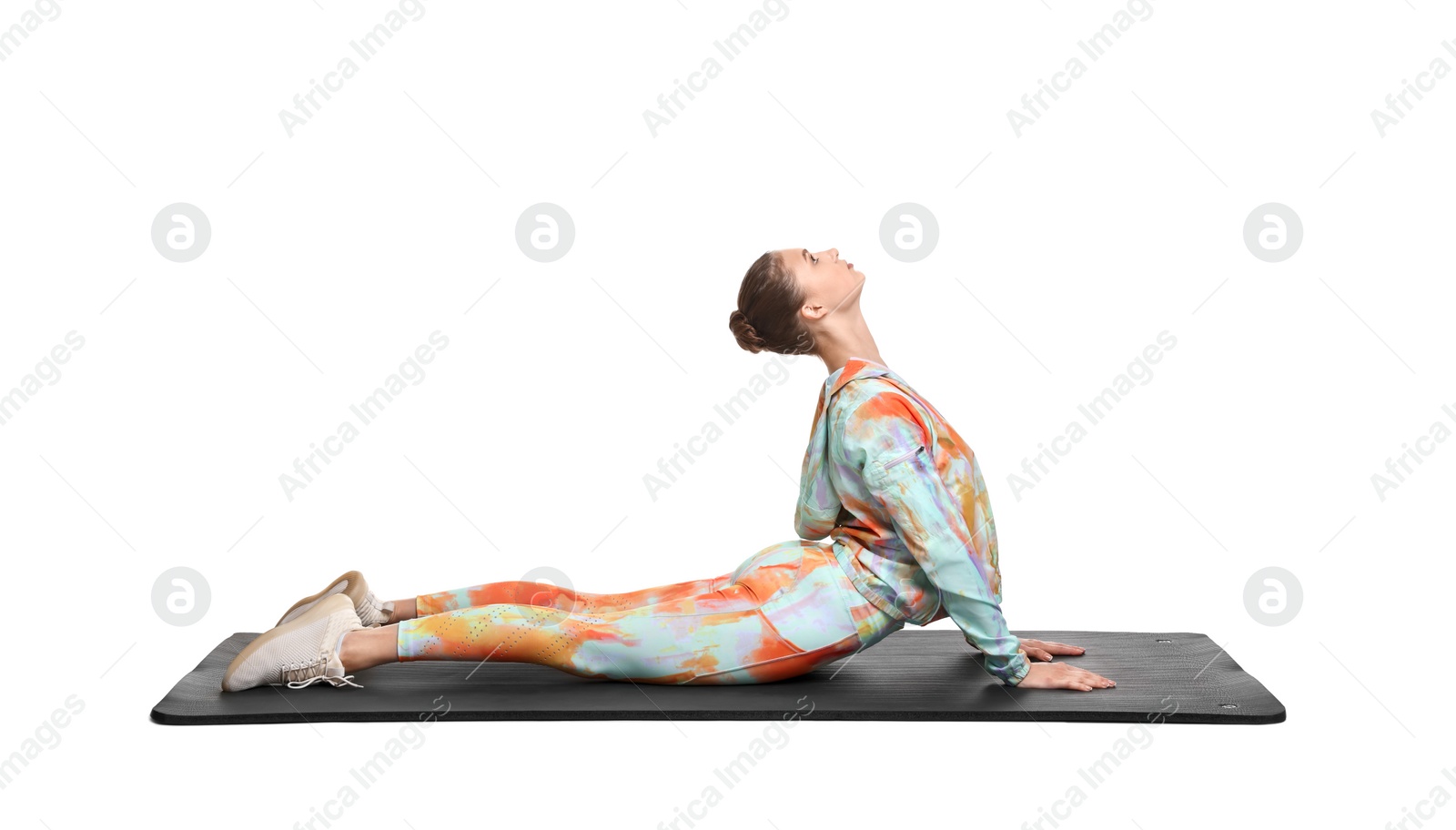 Photo of Young woman practicing yoga on white background