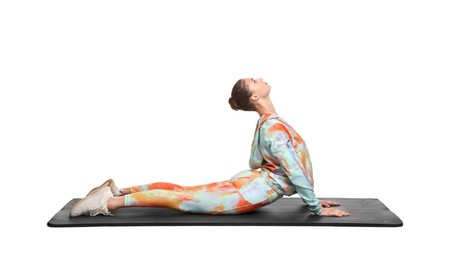 Photo of Young woman practicing yoga on white background