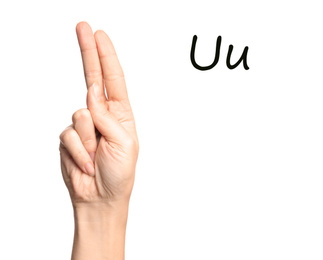 Image of Woman showing letter U on white background, closeup. Sign language