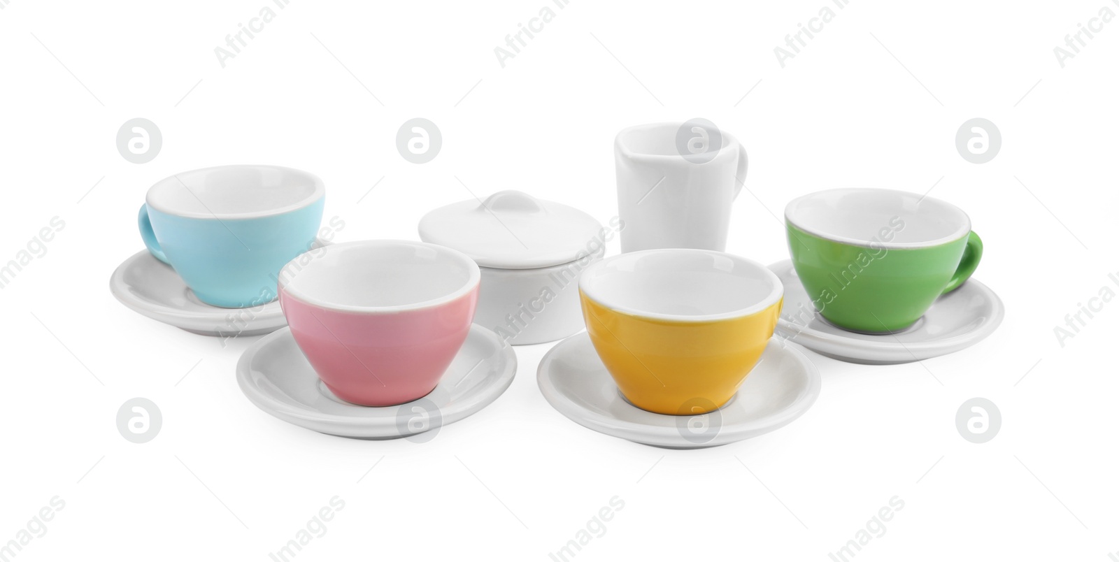 Photo of Set of cups isolated on white. Children's toys