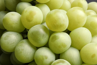 Bunch of green fresh ripe juicy grapes as background. Closeup view