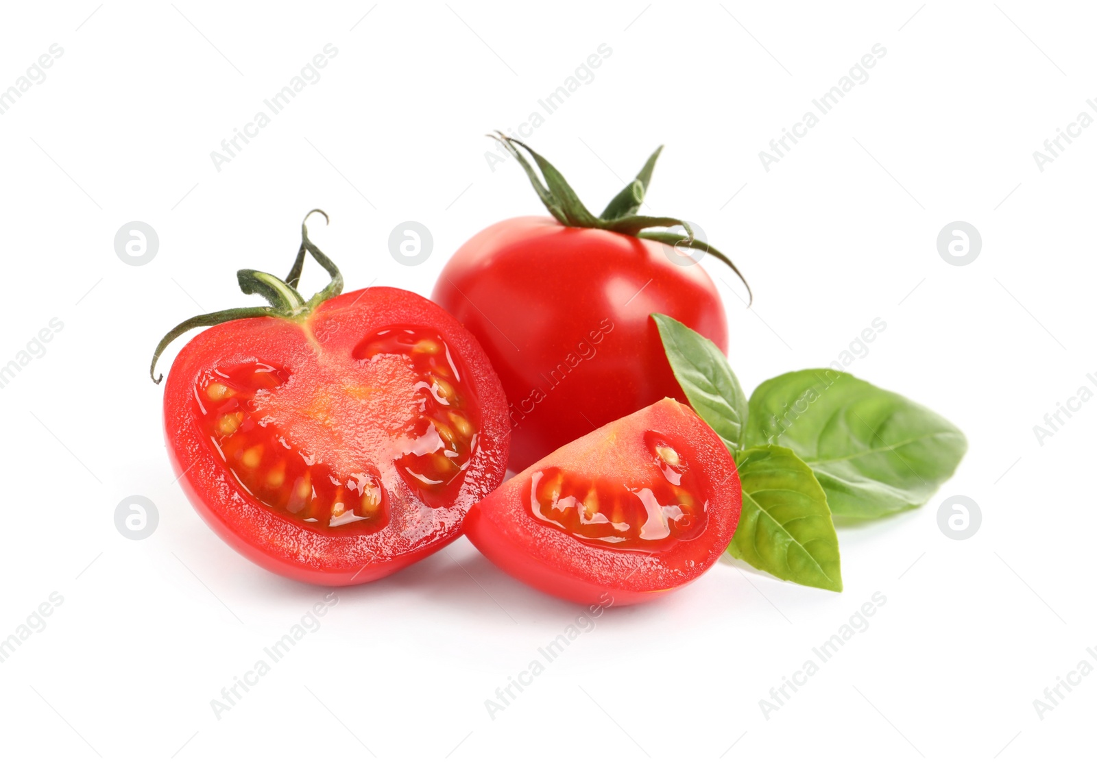 Photo of Fresh cherry tomatoes with basil isolated on white