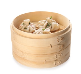 Photo of Bamboo steamer with tasty baozi dumplings on white background