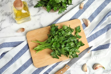 Photo of Flat lay composition with fresh green parsley on table