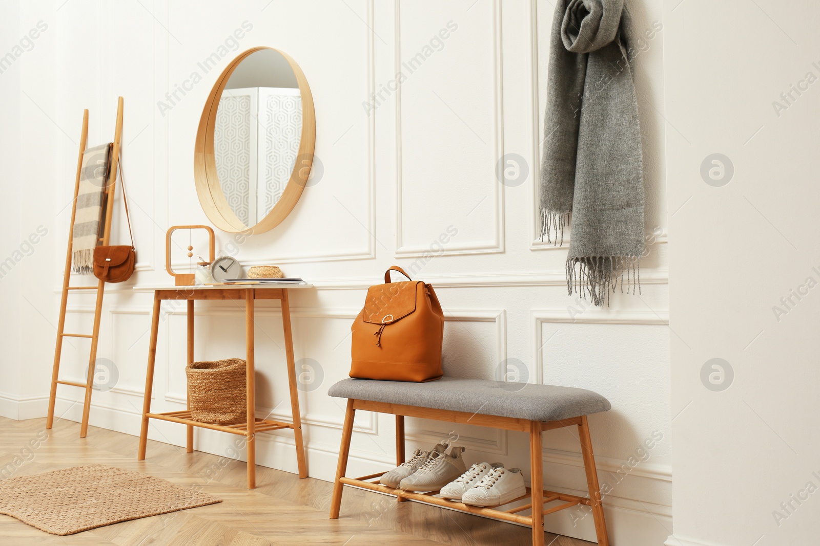 Photo of Hallway interior with stylish furniture, clothes and accessories