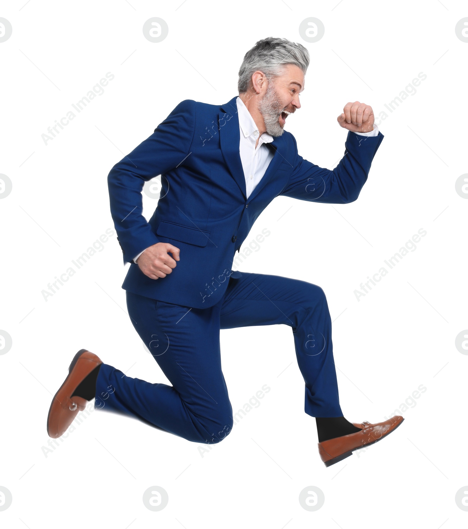 Photo of Mature businessman in stylish clothes jumping on white background