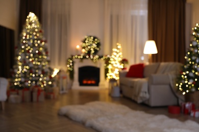 Photo of Blurred view of living room with Christmas decorations. Interior design