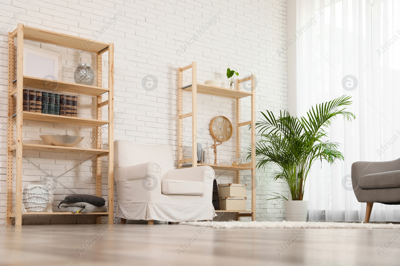 Photo of Wooden storage in stylish living room. Idea for interior design