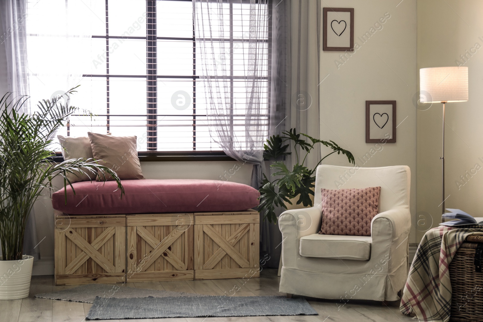 Photo of Elegant living room interior with comfortable armchair near window