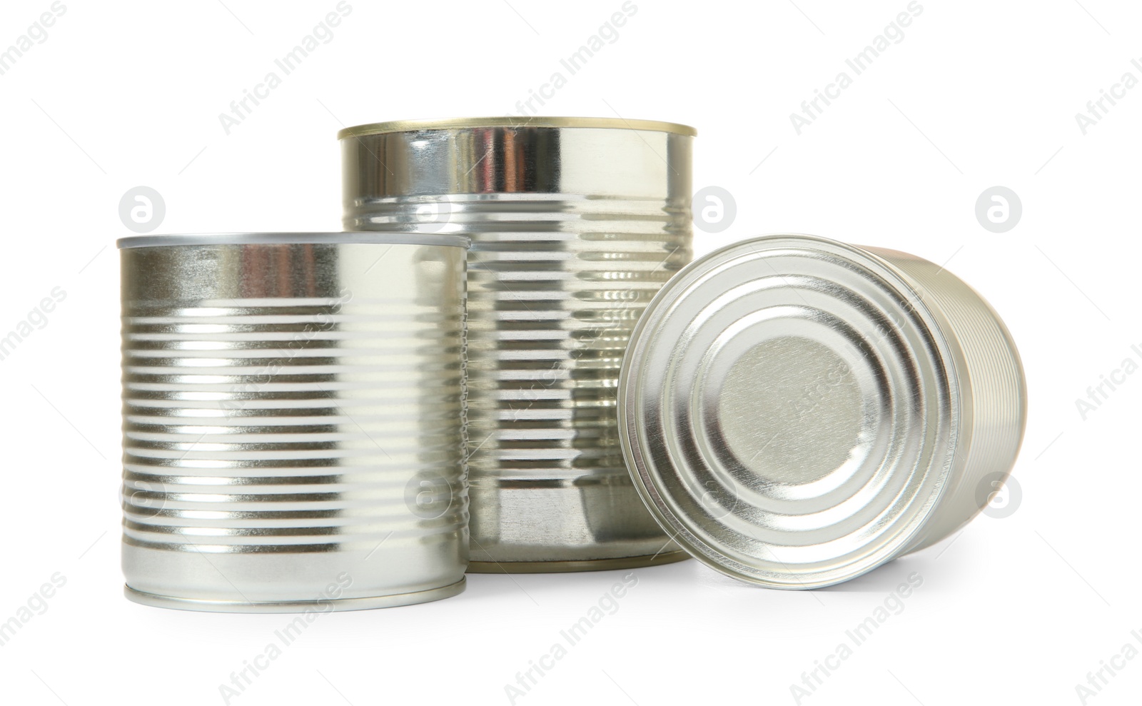 Photo of Closed tin cans isolated on white, mockup for design