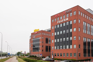 Photo of Warsaw, Poland - September 10, 2022: Buildings with many modern logos